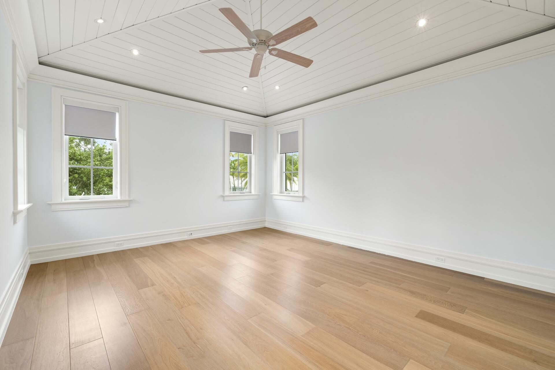 8 Osprey Drive Ocean Ridge, FL 33435 - Photo 27 of 51 an empty room with wooden floor and windows