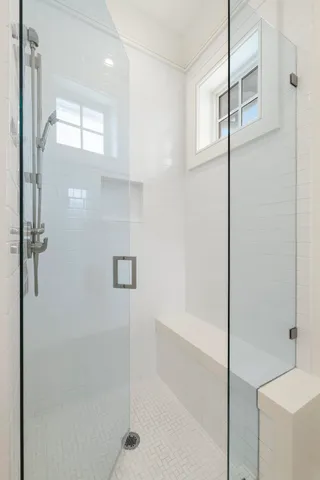 a bathroom with a bathtub and shower