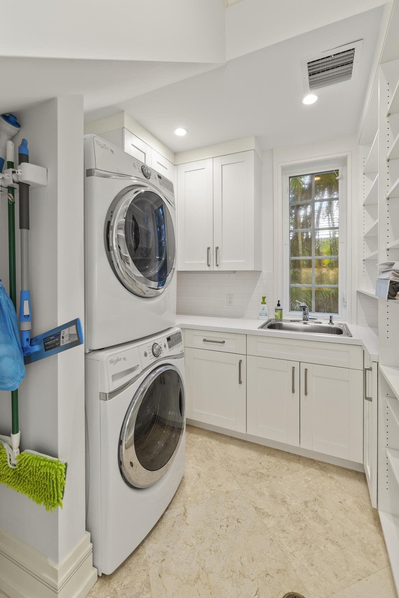 8 Osprey Drive Ocean Ridge, FL 33435 - Photo 31 of 51 a utility room with sink dryer and washer