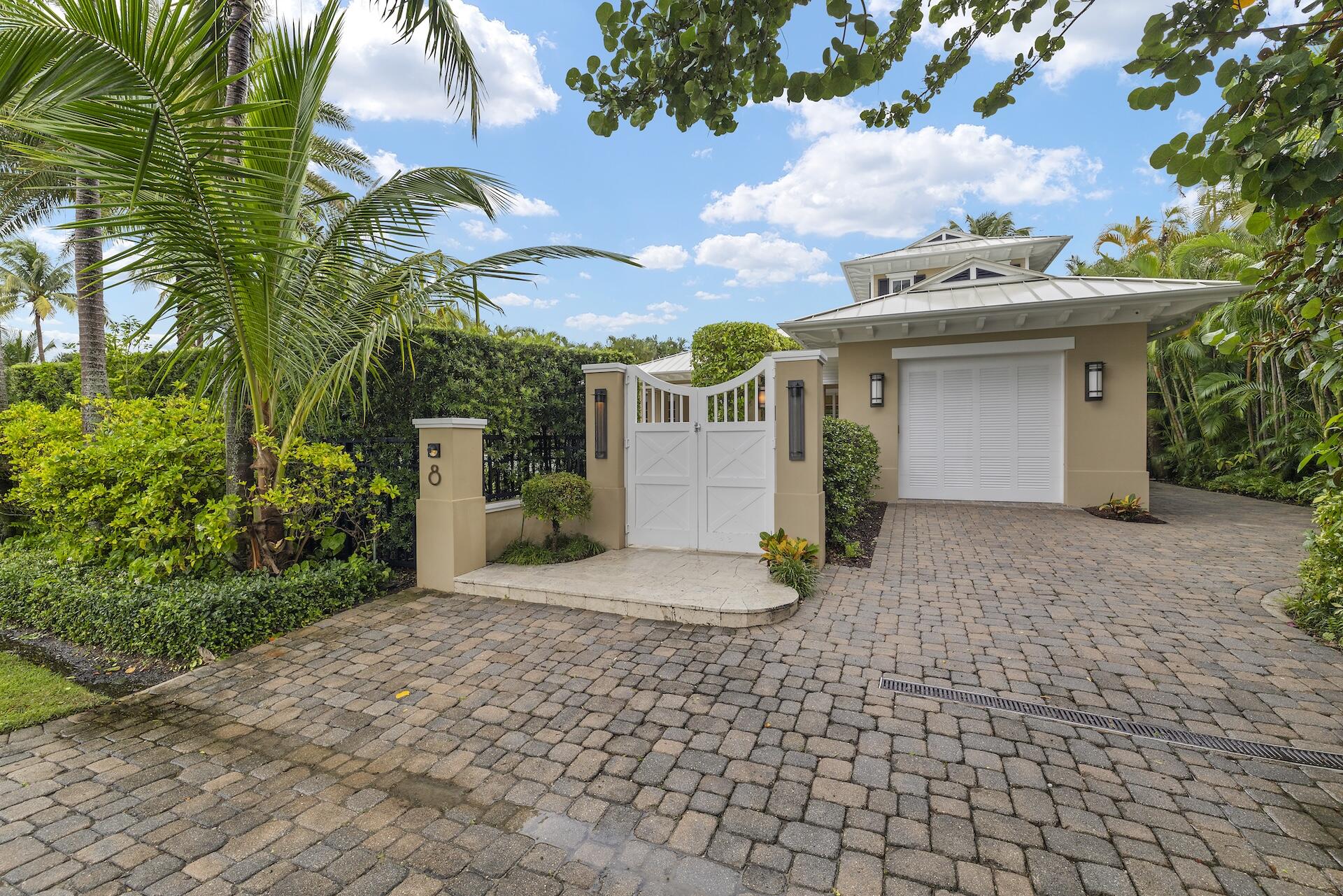 8 Osprey Drive Ocean Ridge, FL 33435 - Photo 33 of 51 a view of a white house with a sink and yard next to a road