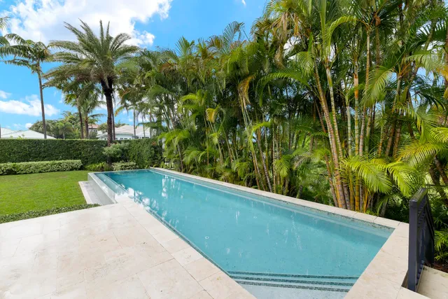 a view of a swimming pool with a garden