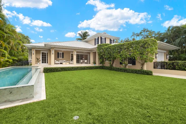 a view of a house with a yard porch and sitting area