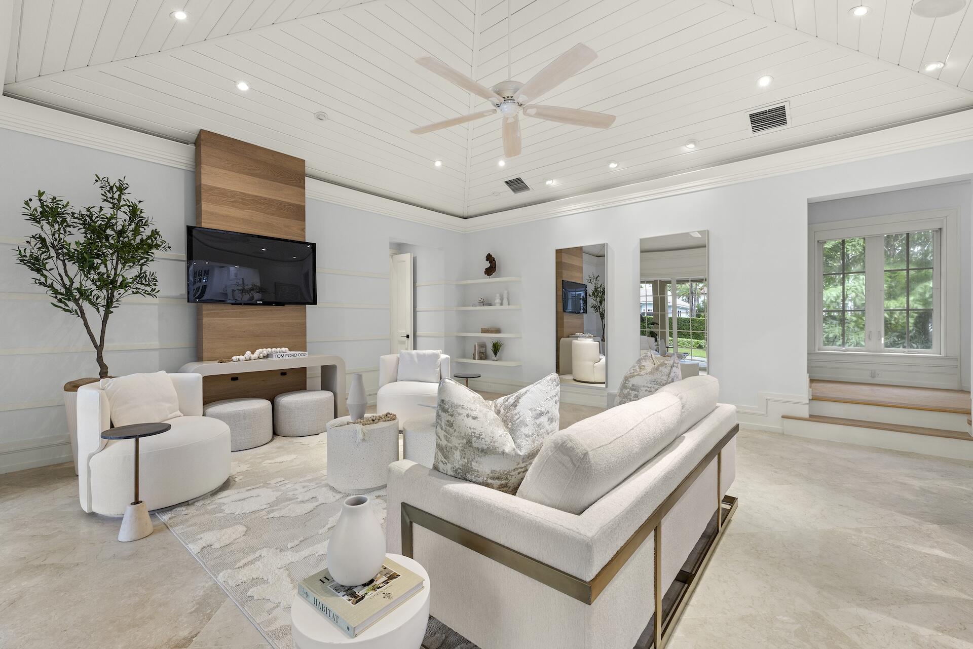 8 Osprey Drive Ocean Ridge, FL 33435 - Photo 5 of 51 a living room with furniture and a flat screen tv