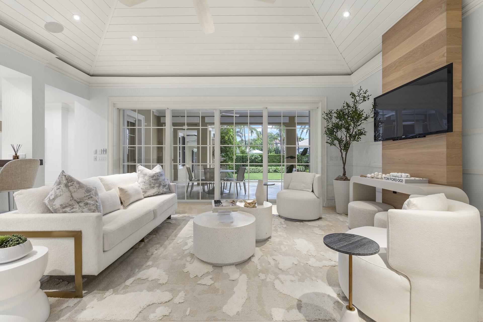 8 Osprey Drive Ocean Ridge, FL 33435 - Photo 6 of 51 a living room with furniture and a flat screen tv