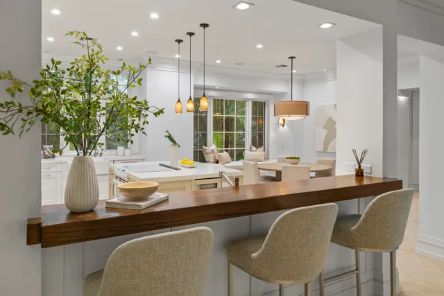 a kitchen with a table and chairs in it