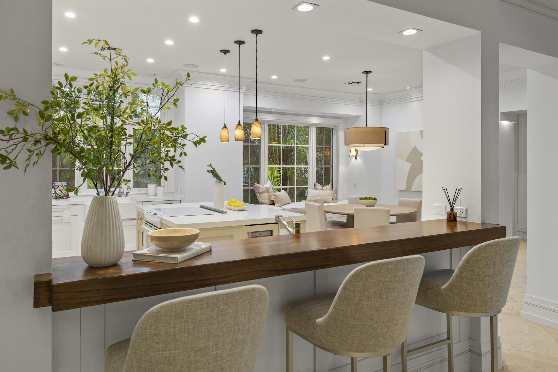 8 Osprey Drive Ocean Ridge, FL 33435 - Photo 7 of 51 a kitchen with a table and chairs in it