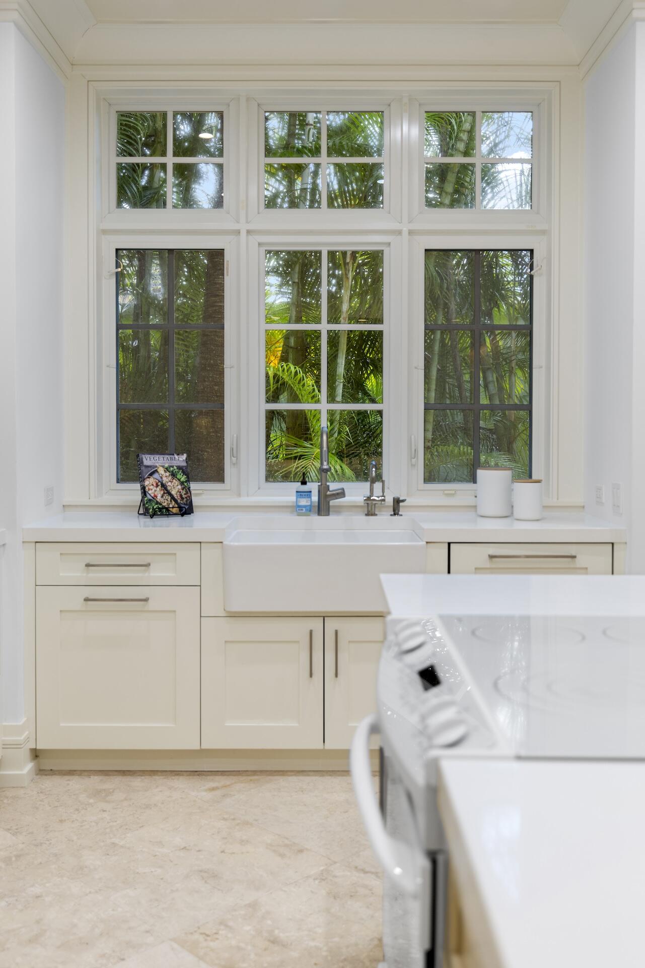 8 Osprey Drive Ocean Ridge, FL 33435 - Photo 10 of 51 a kitchen with a sink and large window