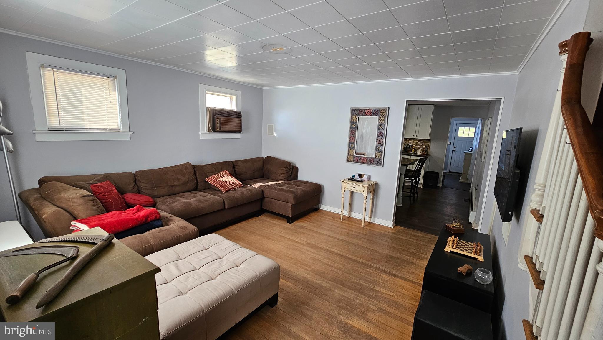 74 Ribsam Street Hamilton, NJ 08619 - Photo 11 of 35 a living room with furniture a window and a flat screen tv