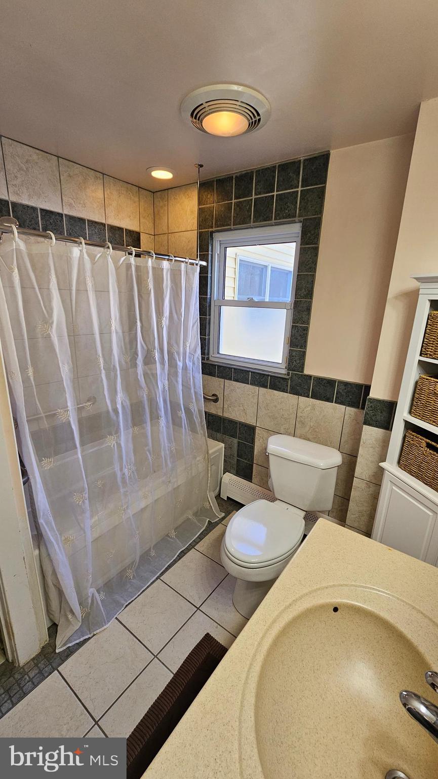 74 Ribsam Street Hamilton, NJ 08619 - Photo 19 of 35 a bathroom with a toilet and a shower