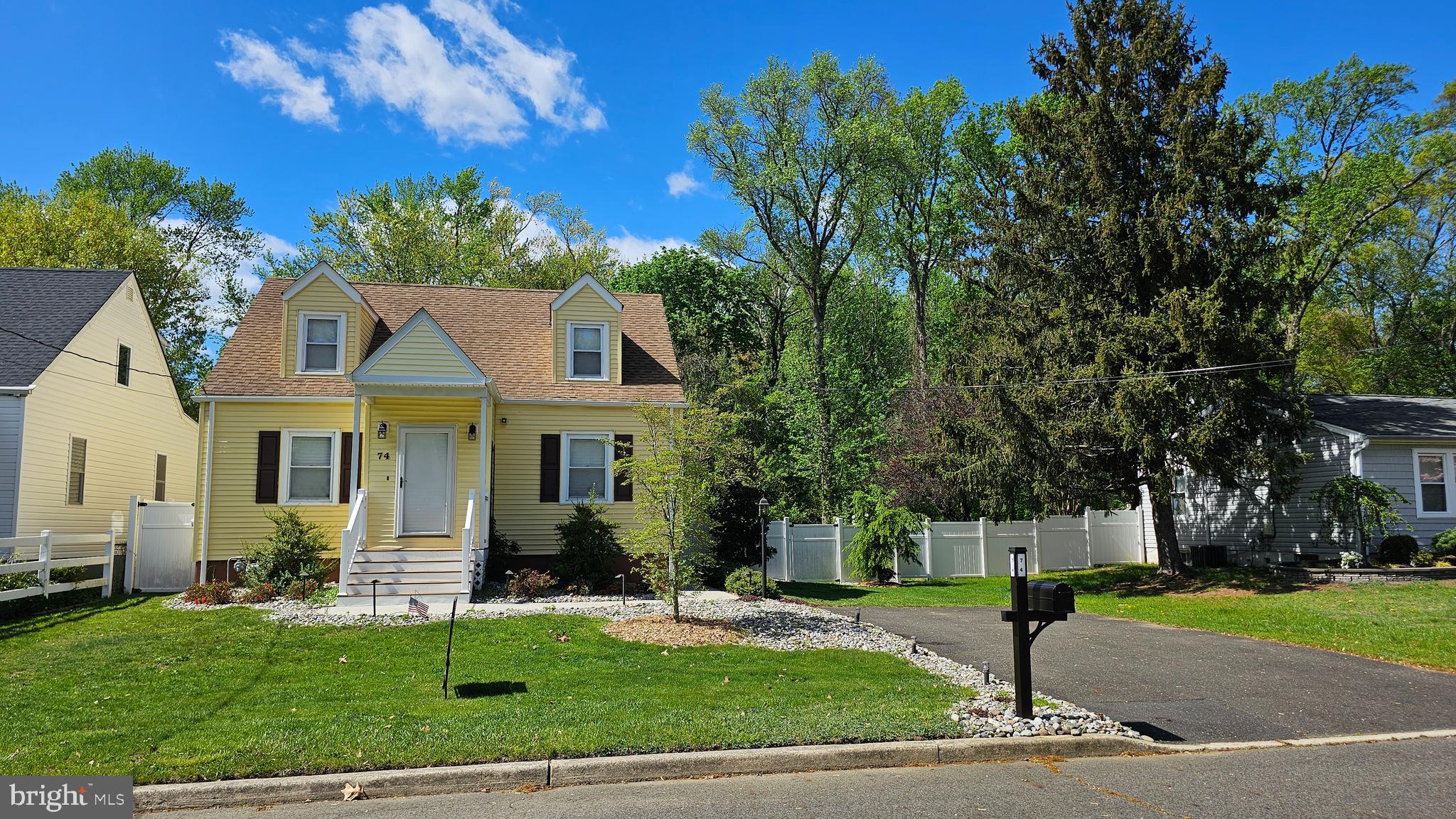 74 Ribsam Street Hamilton, NJ 08619 - Photo 2 of 35 a front view of a house with a yard