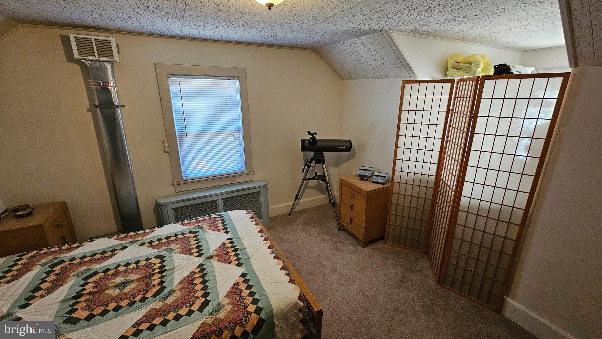 74 Ribsam Street Hamilton, NJ 08619 - Photo 25 of 35 a bedroom with a bed and wooden floor