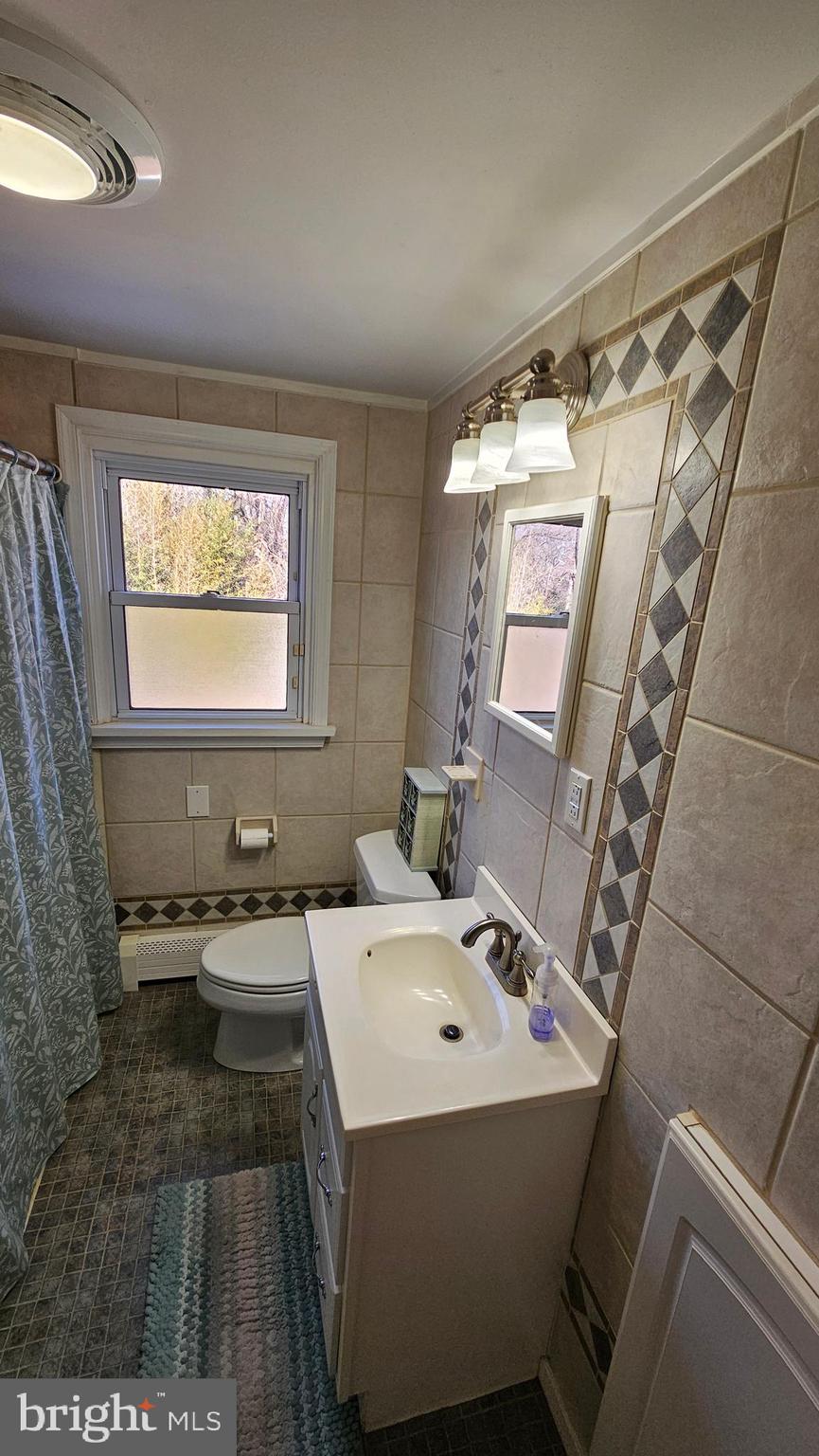 74 Ribsam Street Hamilton, NJ 08619 - Photo 27 of 35 a bathroom with a sink and a mirror