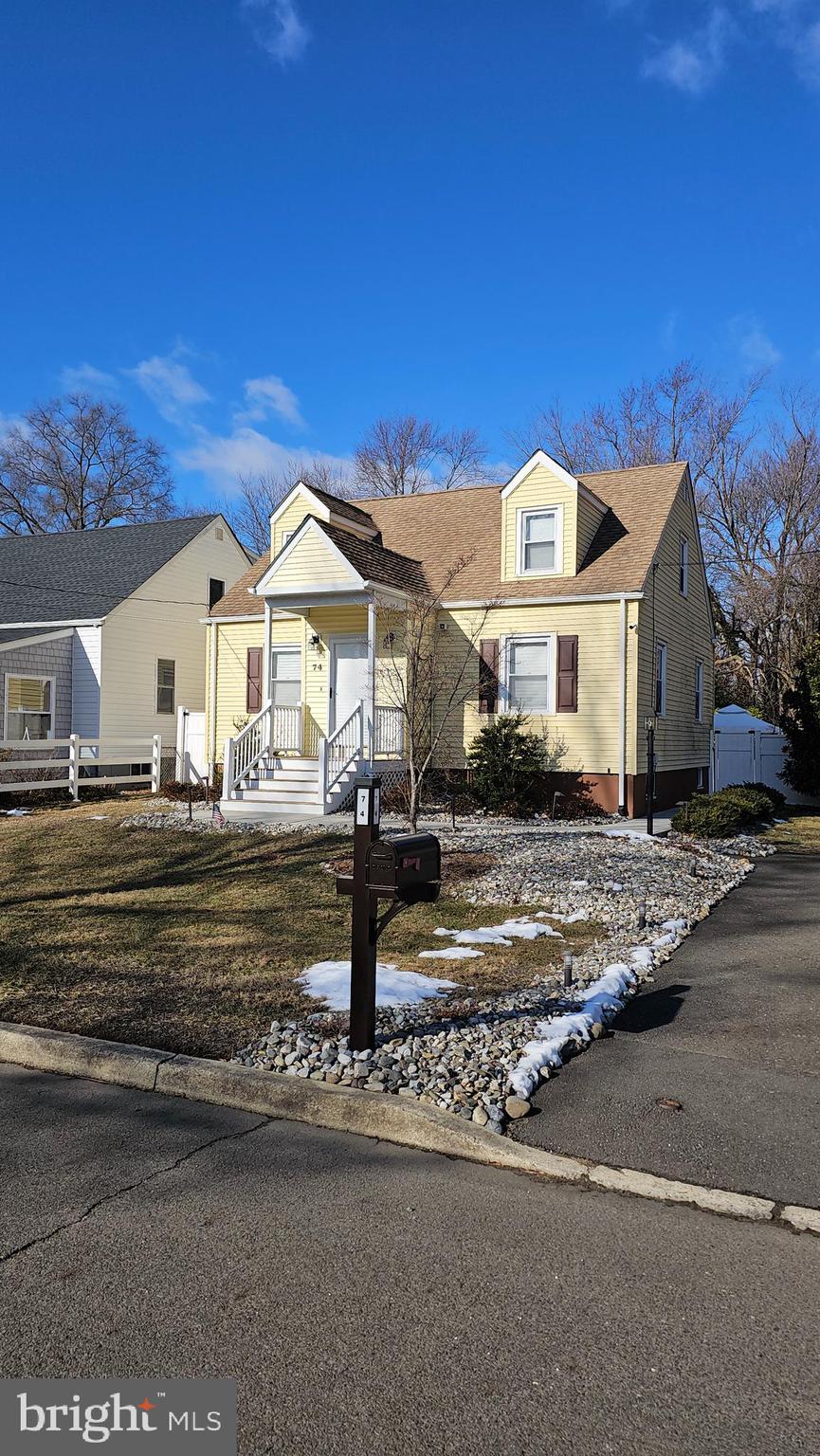 74 Ribsam Street Hamilton, NJ 08619 - Photo 3 of 35 a front view of a house with a yard