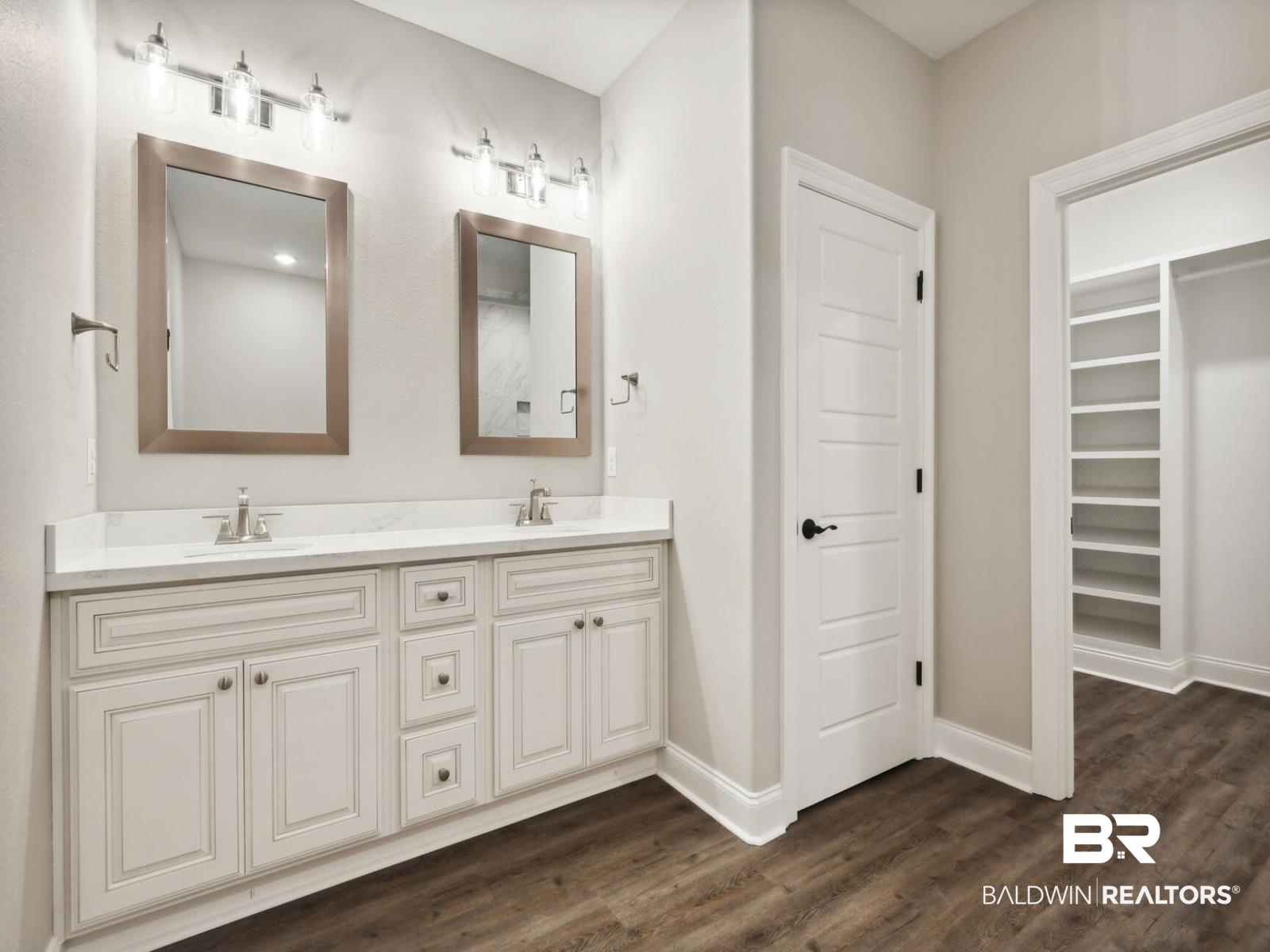 12942 Gondala Street Elberta, AL 36530 - Photo 10 of 18 Full bath with double vanity, dark wood finished floors, and a walk in closet