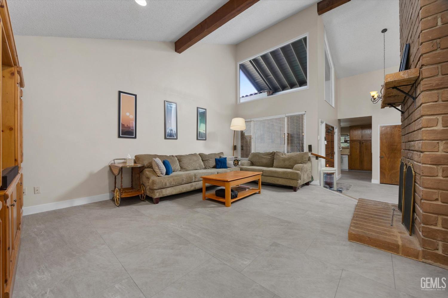 Undisclosed Address Bakersfield, CA 93309 - Photo 15 of 35 a living room with furniture and a couch