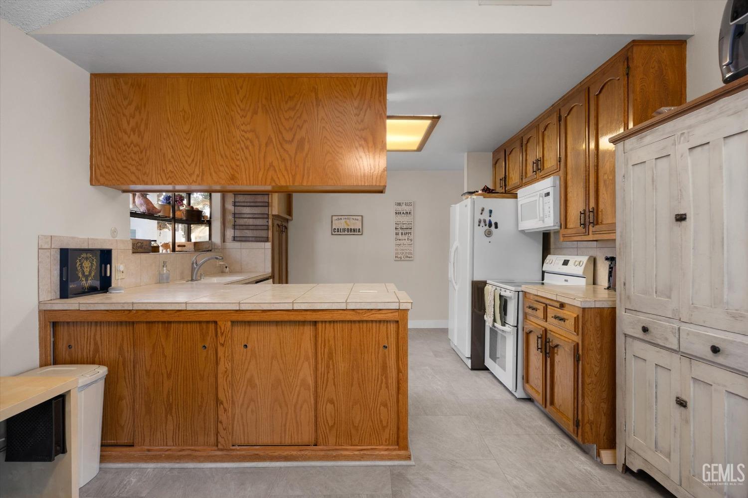 Undisclosed Address Bakersfield, CA 93309 - Photo 19 of 35 a kitchen with stainless steel appliances granite countertop a sink a stove and a refrigerator