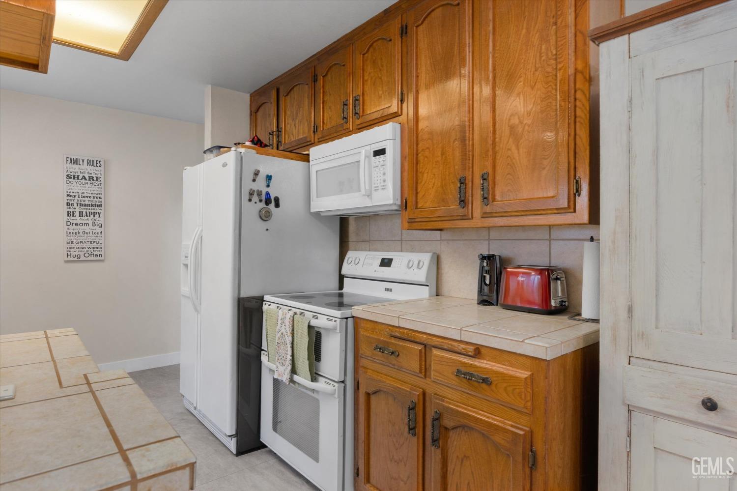 Undisclosed Address Bakersfield, CA 93309 - Photo 20 of 35 a kitchen with stainless steel appliances granite countertop a refrigerator a stove and a sink