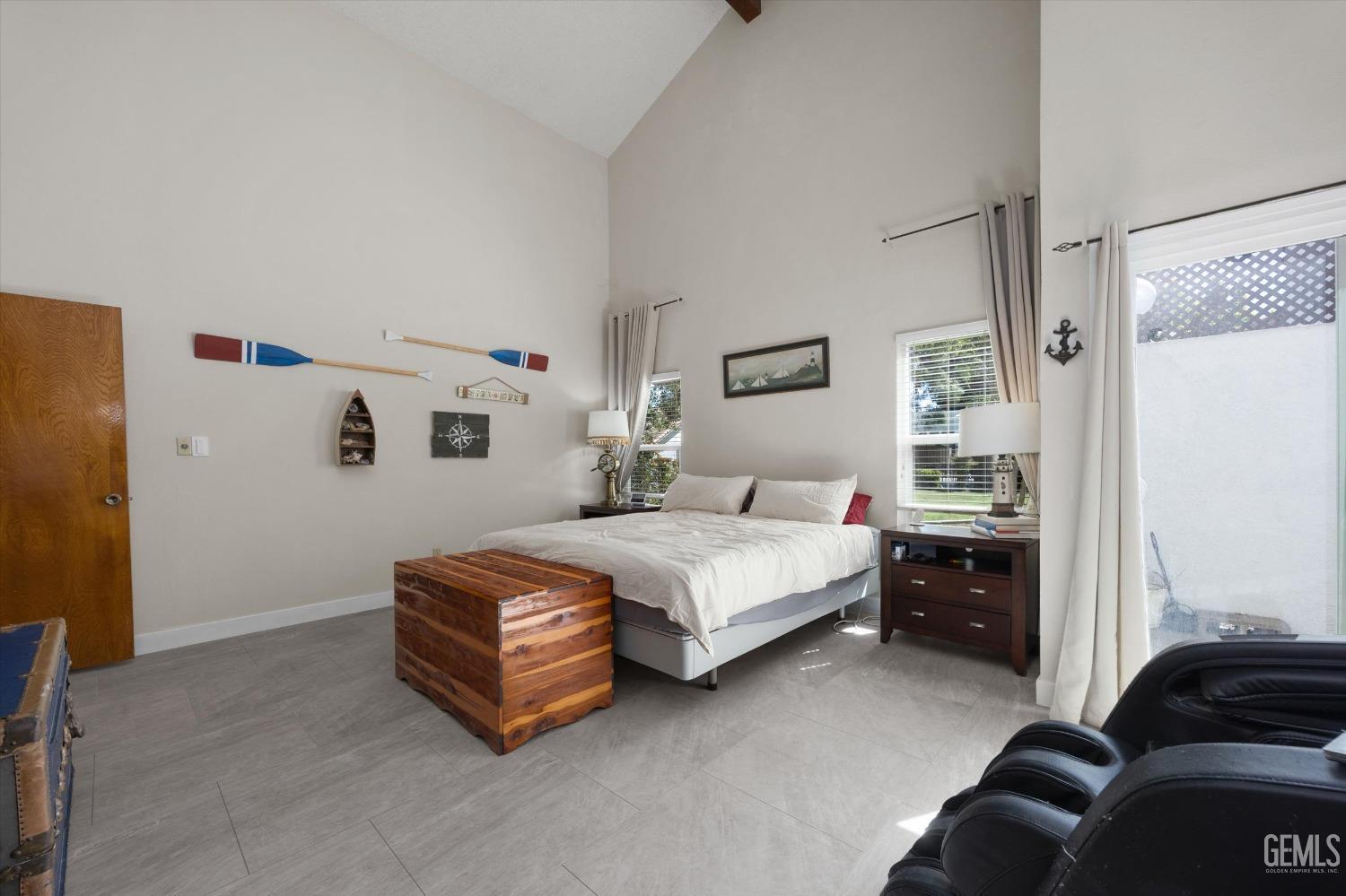 Undisclosed Address Bakersfield, CA 93309 - Photo 24 of 35 a bedroom with a bed and a couch