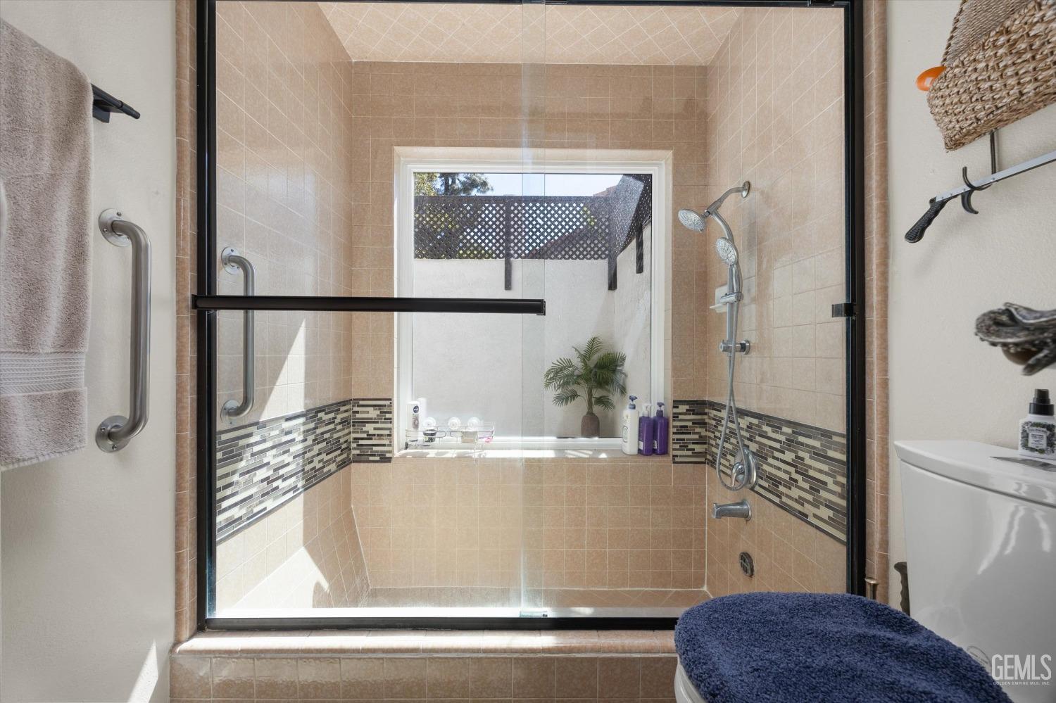 Undisclosed Address Bakersfield, CA 93309 - Photo 27 of 35 a bathroom with a bathtub and a shower