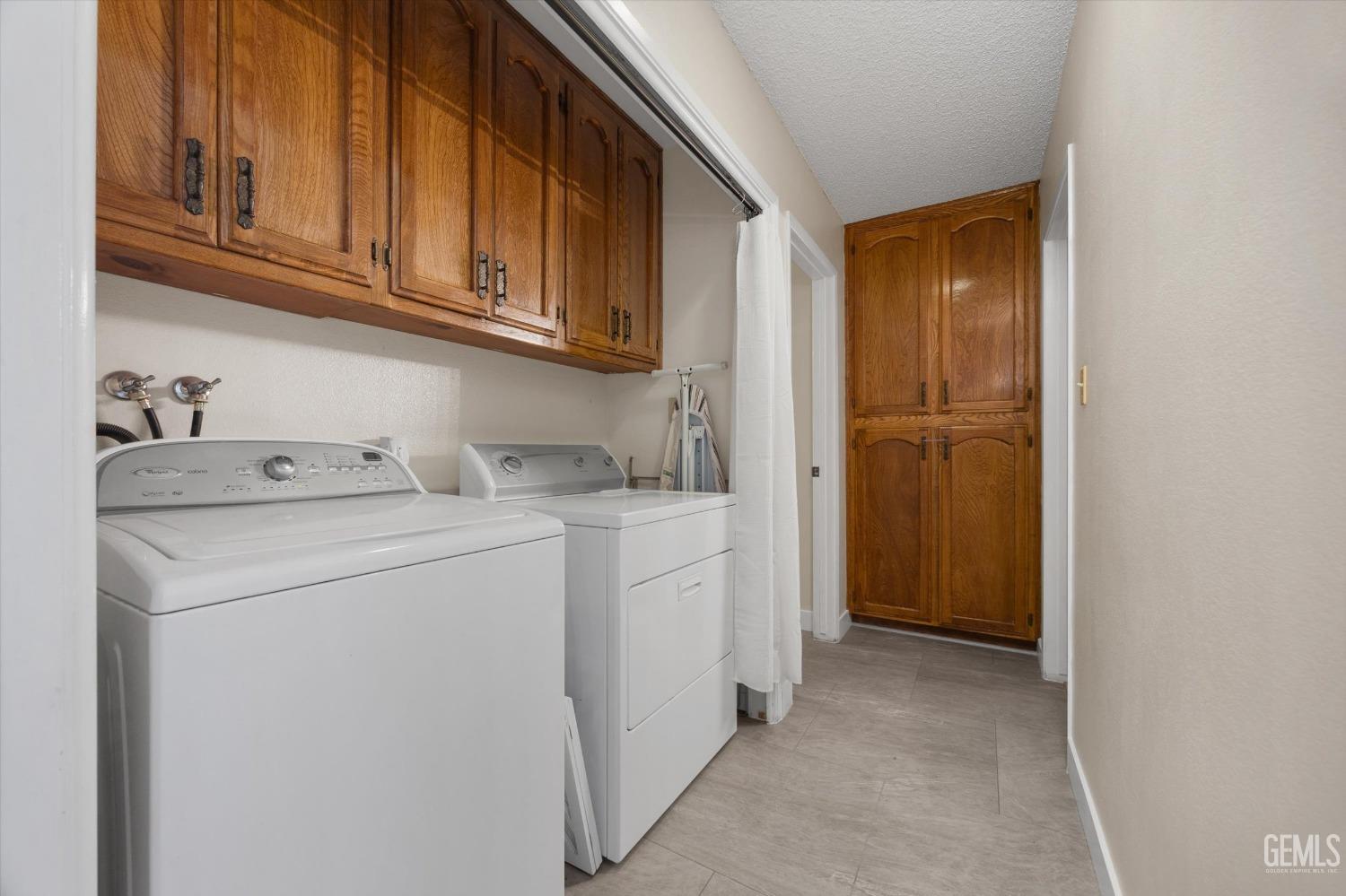 Undisclosed Address Bakersfield, CA 93309 - Photo 32 of 35 a utility room with dryer and washer
