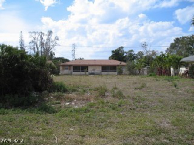 4571 Capri Drive Naples, FL 34103 - Photo 3 of 3 a view of a house with a yard