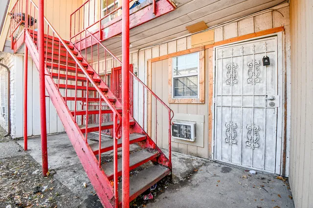 a view of entryway with wooden stairs