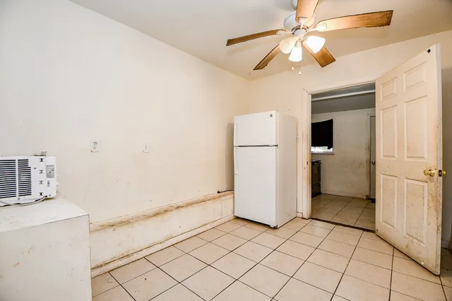 a view of a kitchen with a stove cabinets and a refrigerator