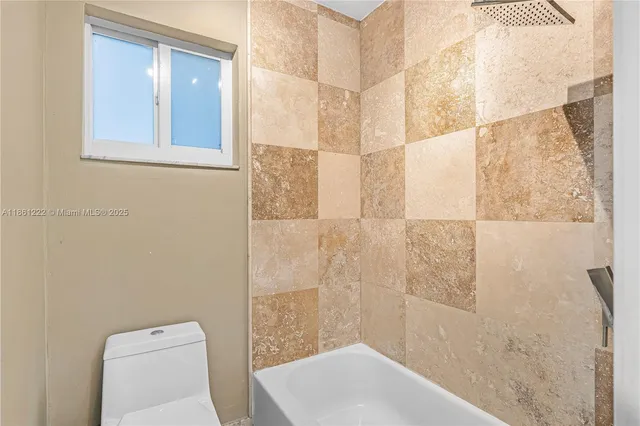 a view of a room with wooden floor and cabinet