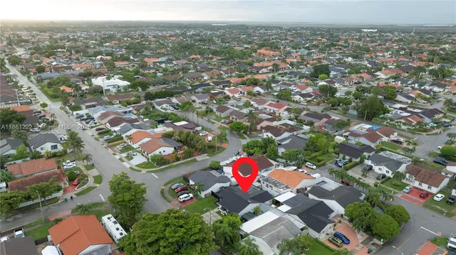 an aerial view of residential houses with outdoor space