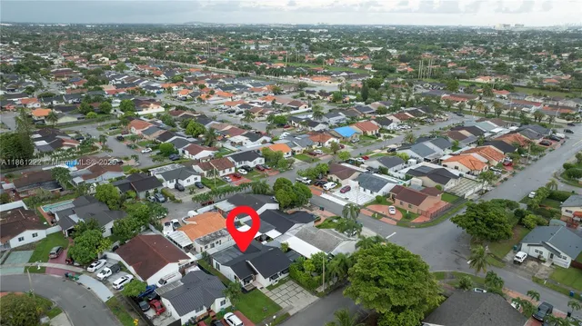 an aerial view of residential houses with outdoor space
