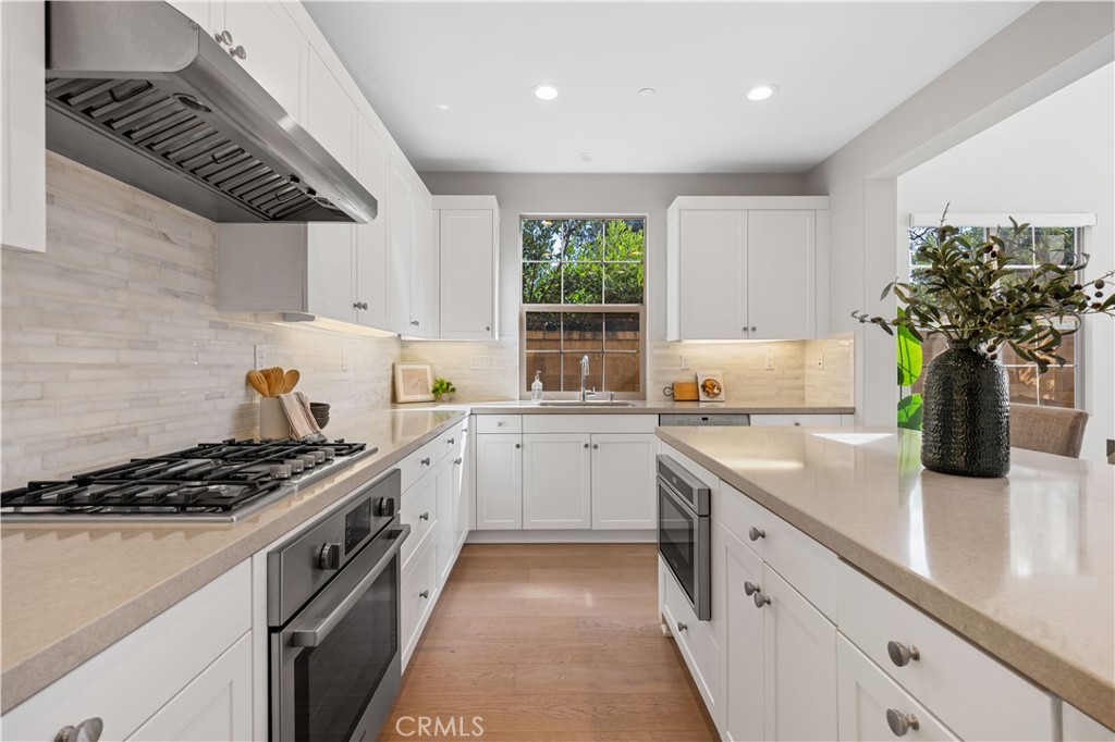 105 Copeland Irvine, CA 92618 - Photo 19 of 46 a kitchen with sink a stove and cabinets