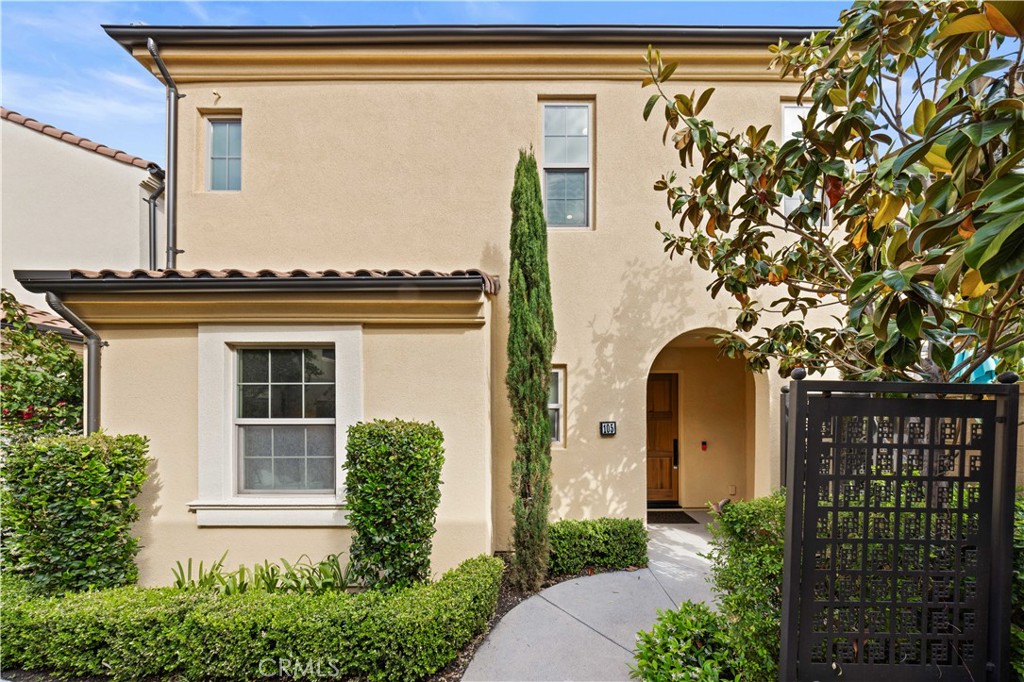 105 Copeland Irvine, CA 92618 - Photo 2 of 46 a front view of a house with a garden