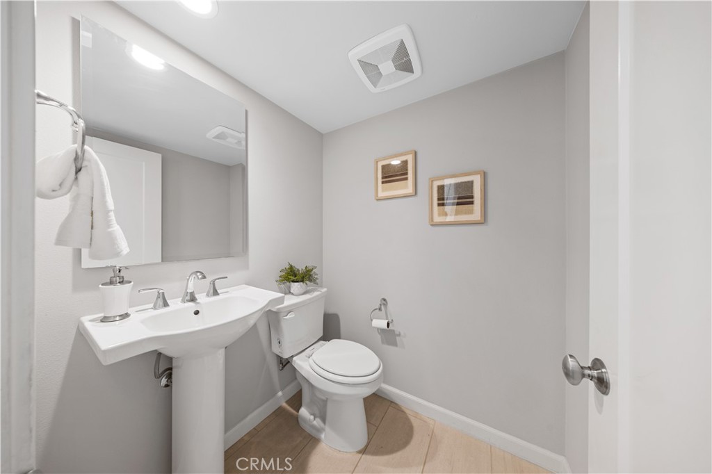 105 Copeland Irvine, CA 92618 - Photo 21 of 46 a bathroom with a toilet sink and mirror