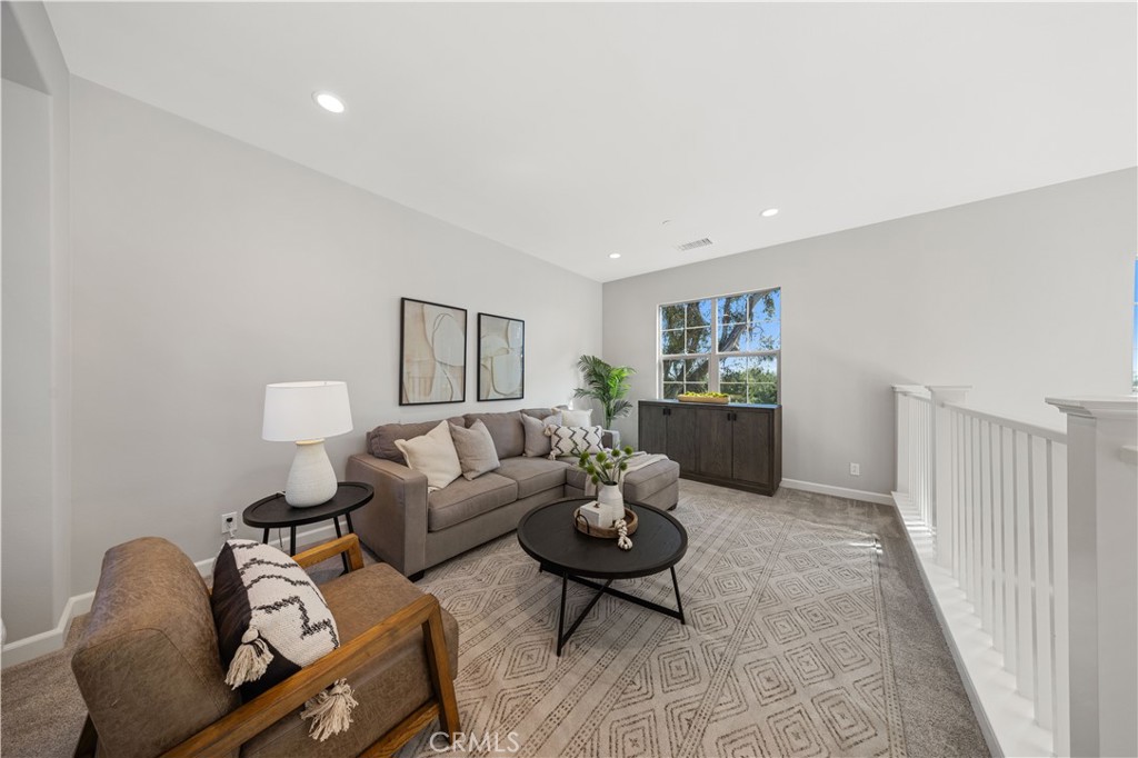 105 Copeland Irvine, CA 92618 - Photo 25 of 46 a living room with furniture and wooden floor