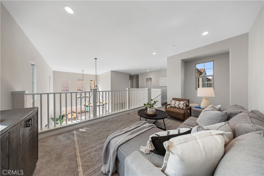 105 Copeland Irvine, CA 92618 - Photo 26 of 46 a living room with furniture and a wooden floor