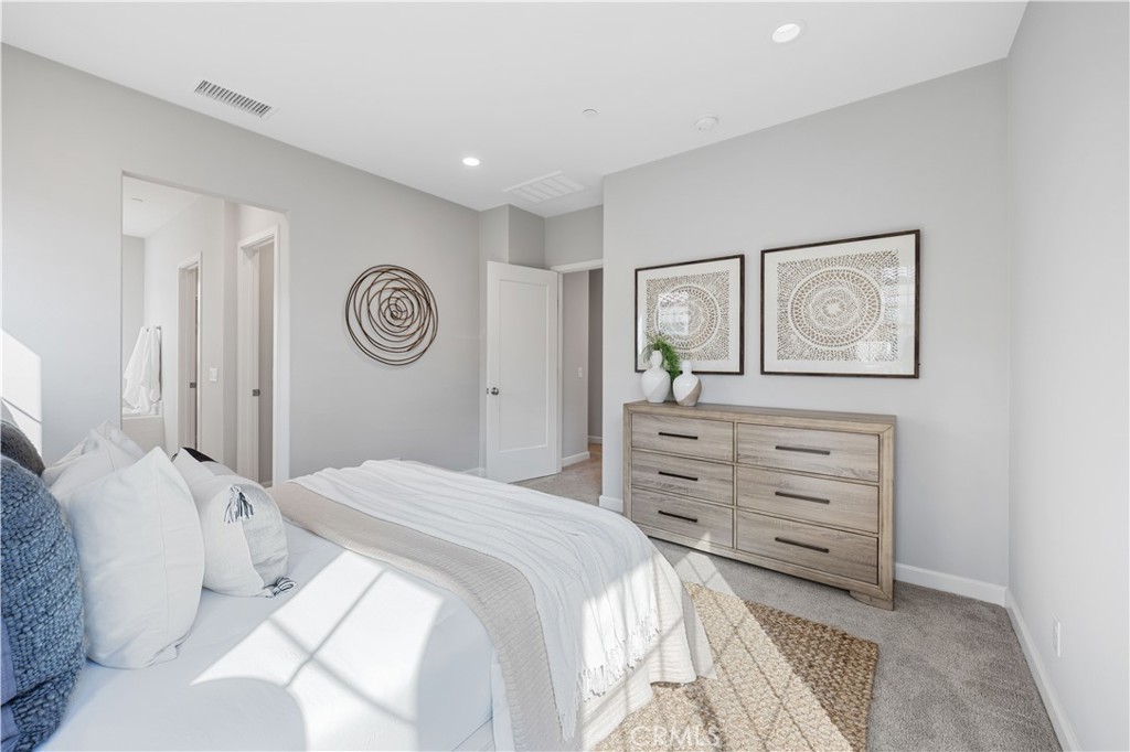 105 Copeland Irvine, CA 92618 - Photo 40 of 46 a bedroom with a bed and a cabinets