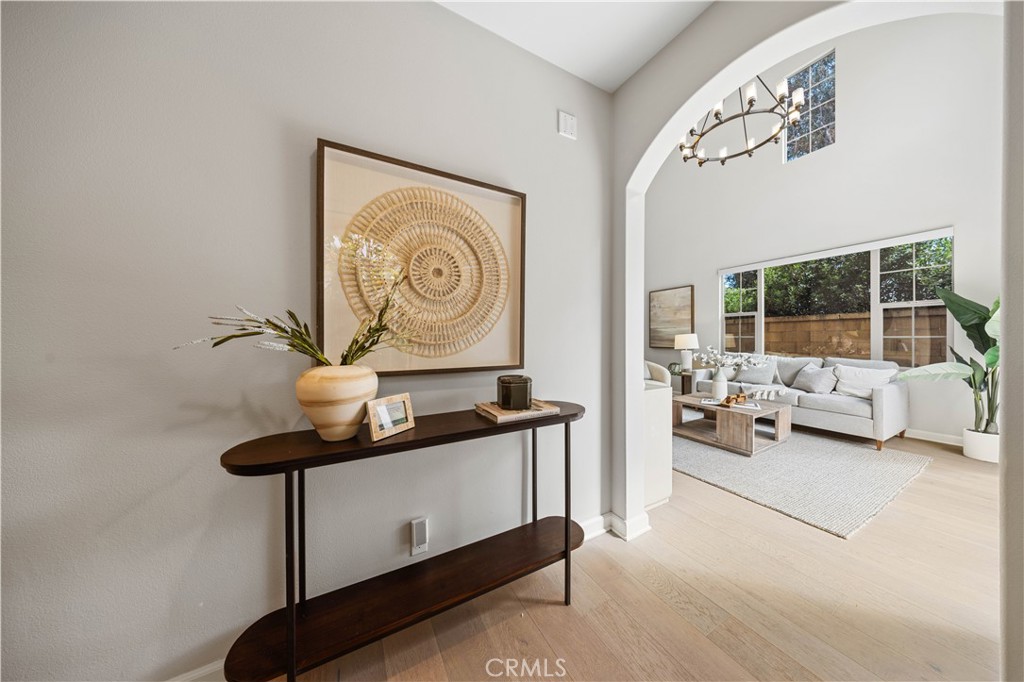 105 Copeland Irvine, CA 92618 - Photo 5 of 46 a view of a hallway with couch and chandelier