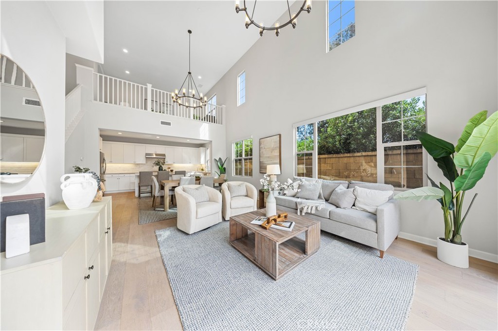 105 Copeland Irvine, CA 92618 - Photo 7 of 46 a living room with patio furniture and a chandelier
