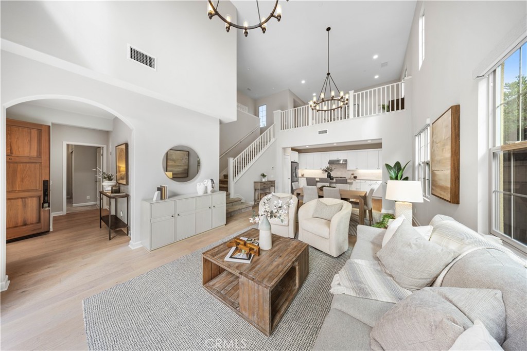105 Copeland Irvine, CA 92618 - Photo 9 of 46 a living room with furniture and a chandelier