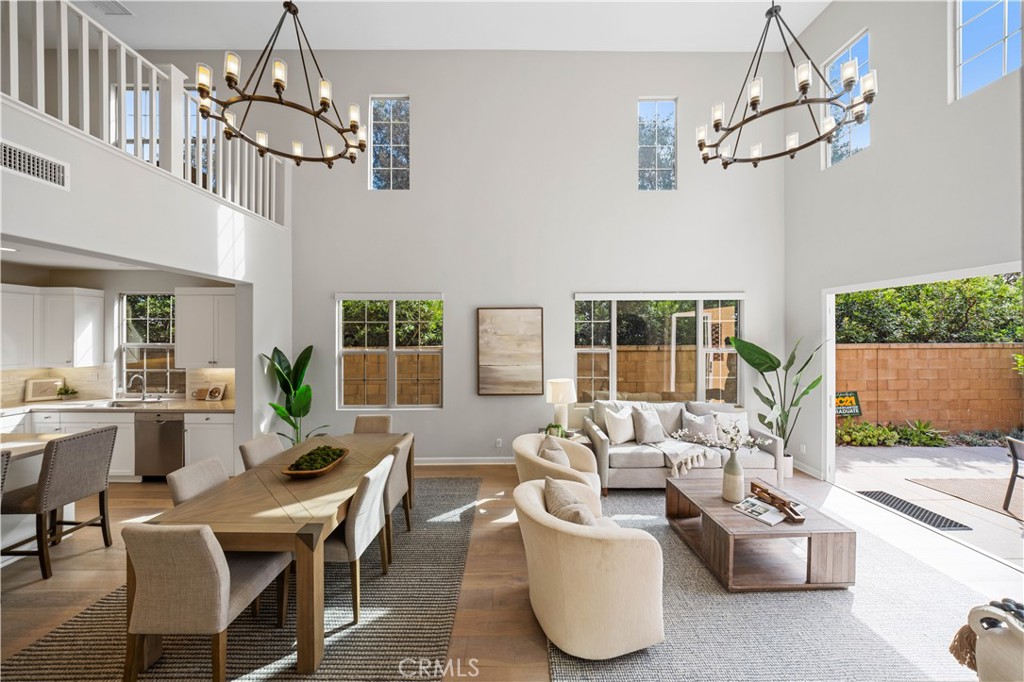 105 Copeland Irvine, CA 92618 - Photo 10 of 46 a living room with patio furniture and a chandelier