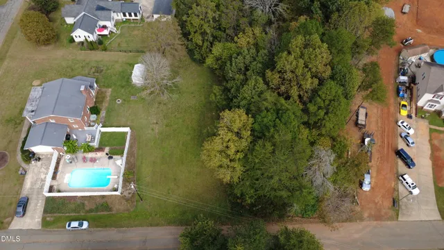 an aerial view of house with yard