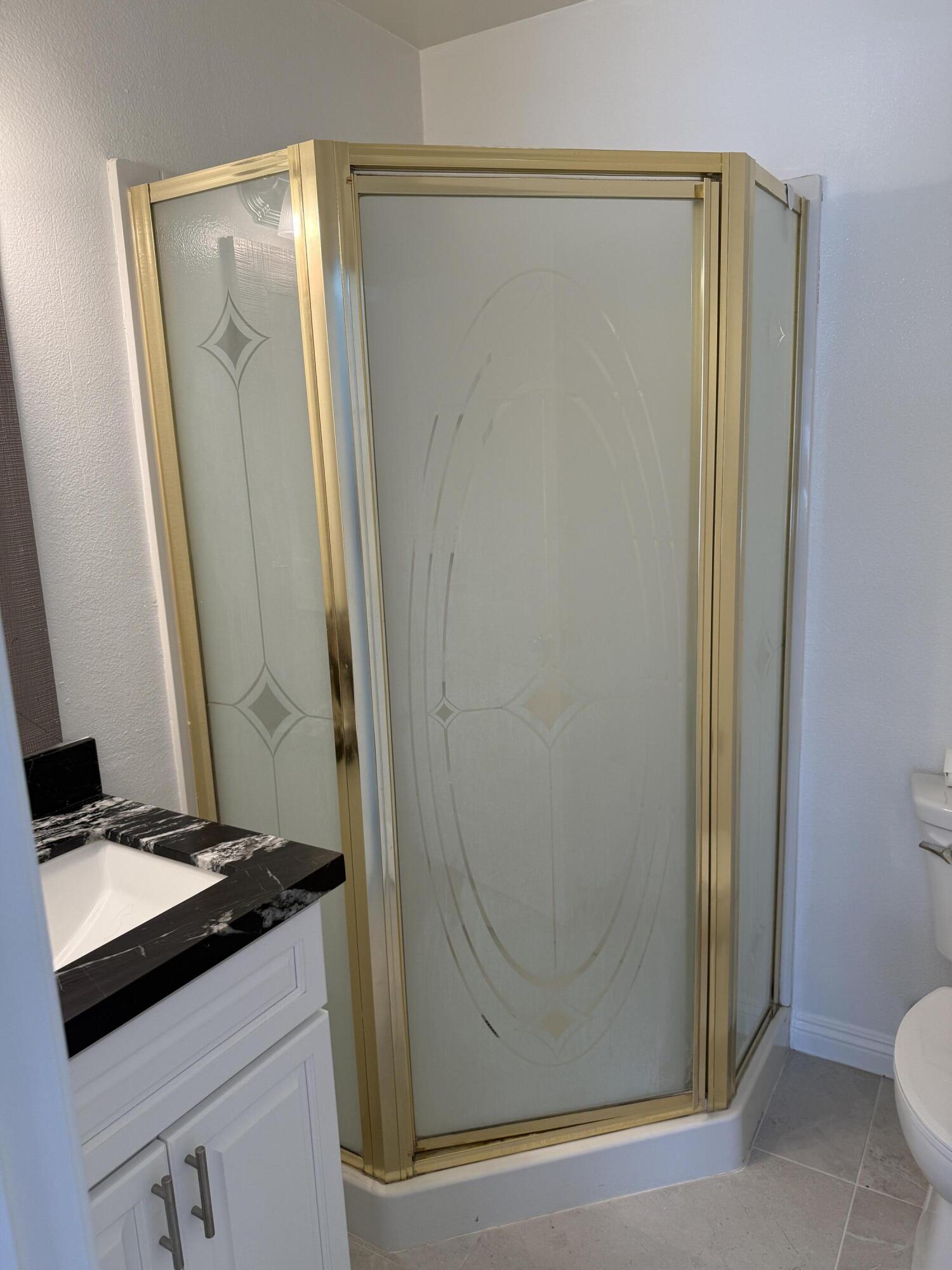 32790 Aurora Vista Road Cathedral City, CA 92234 - Photo 6 of 18 a bathroom with a sink a toilet and shower