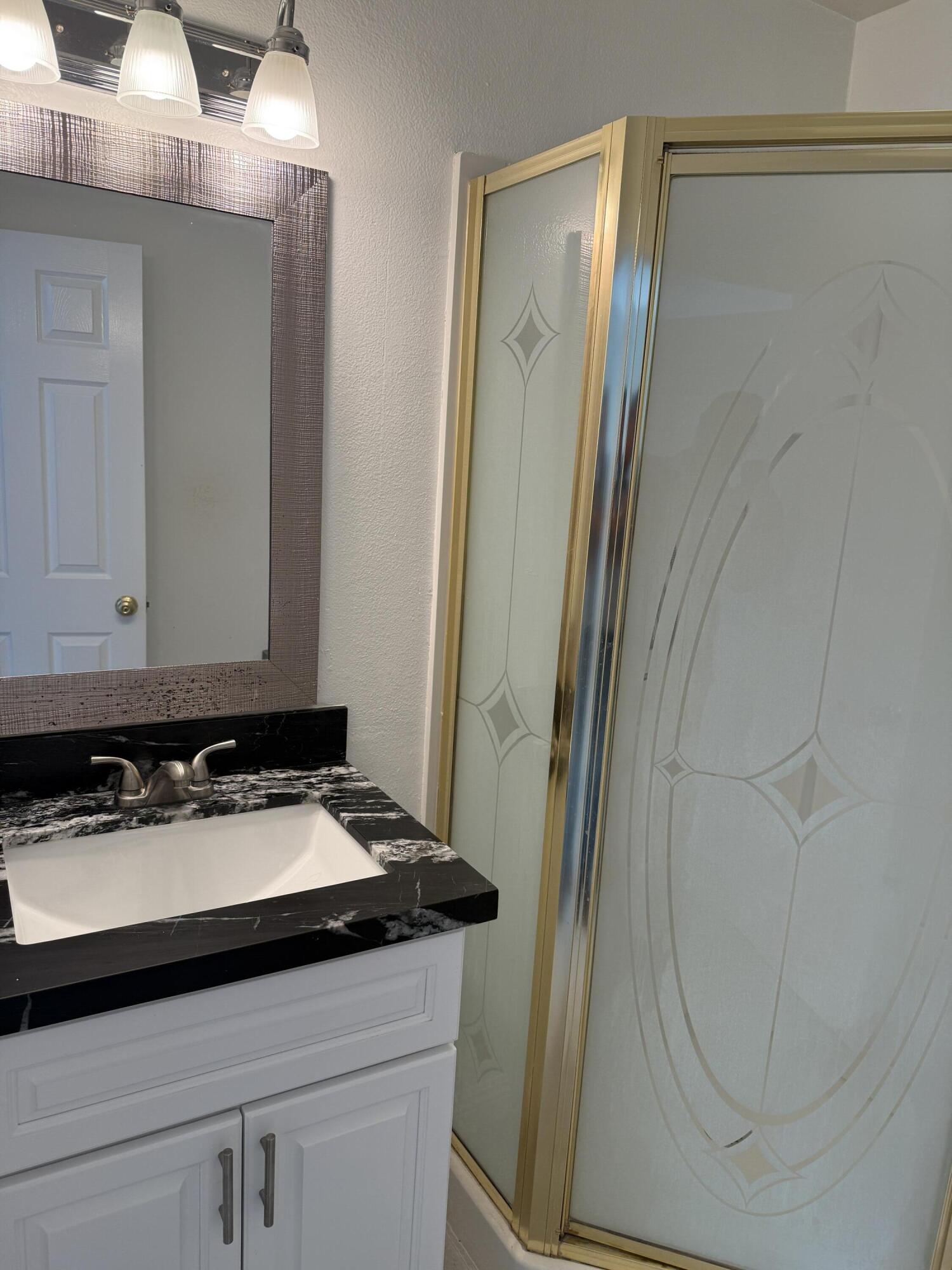 32790 Aurora Vista Road Cathedral City, CA 92234 - Photo 10 of 18 a bathroom with a sink and a mirror