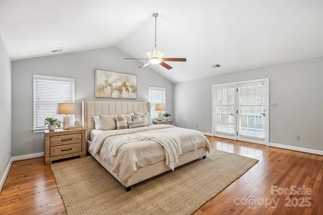 a bedroom with bed and window with lamp