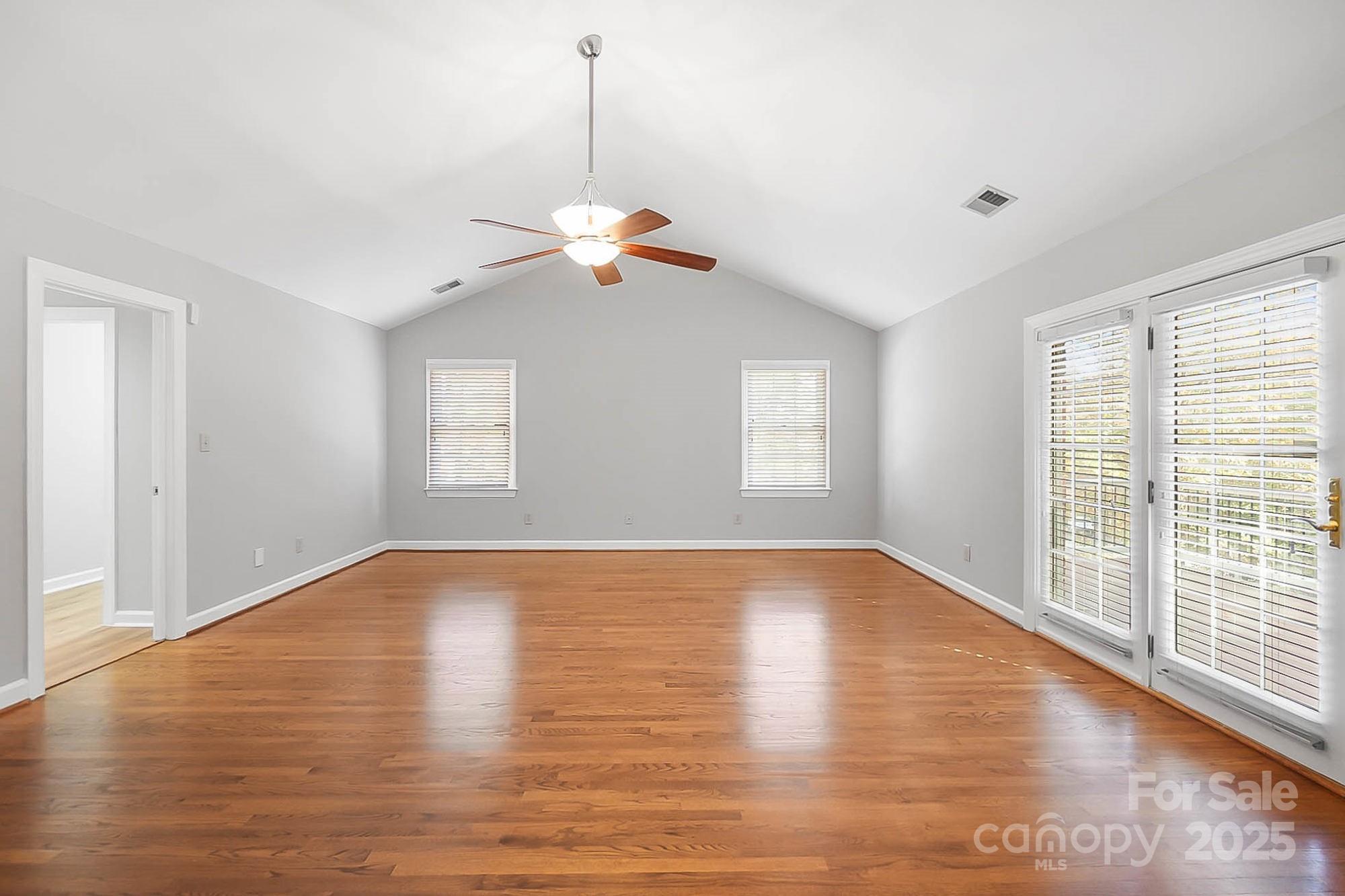3475 Pikeview Road Fort Mill, SC 29715 - Photo 13 of 48 a view of an empty room with wooden floor and a window