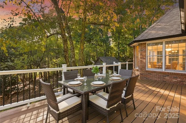 a view of a chairs and table on the deck