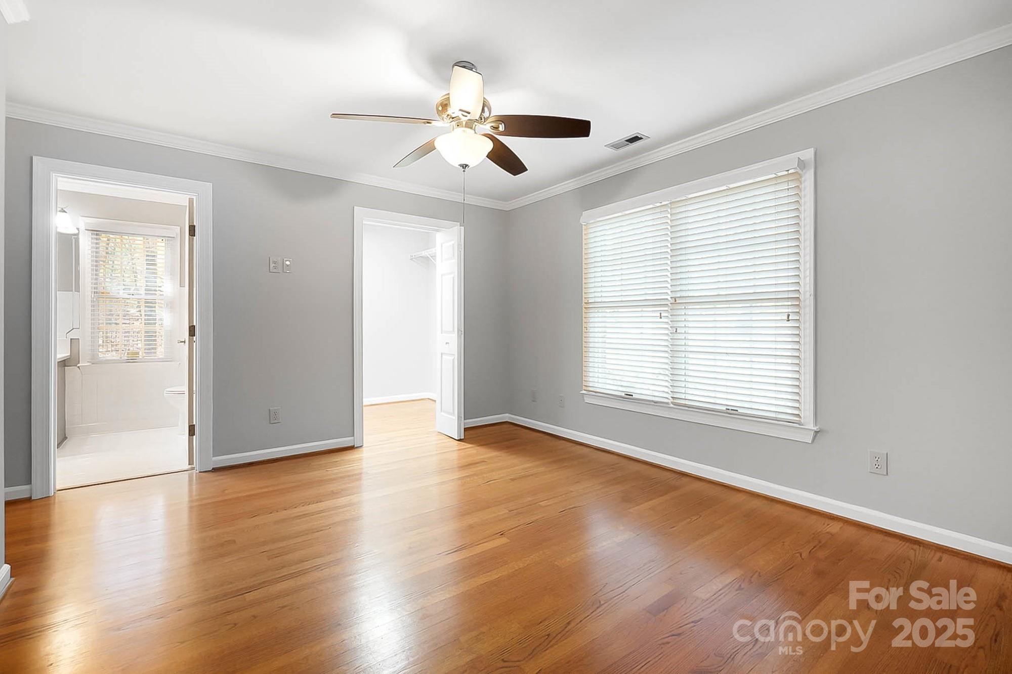 3475 Pikeview Road Fort Mill, SC 29715 - Photo 20 of 48 a view of an empty room with wooden floor and a window