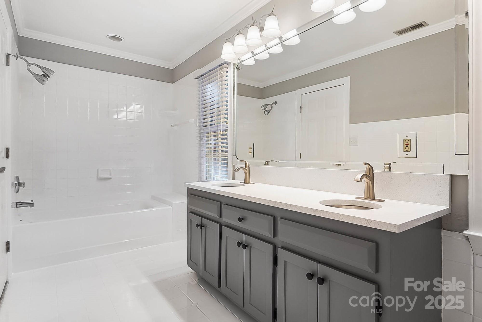 3475 Pikeview Road Fort Mill, SC 29715 - Photo 23 of 48 a bathroom with a sink double vanity granite tub shower and a mirror