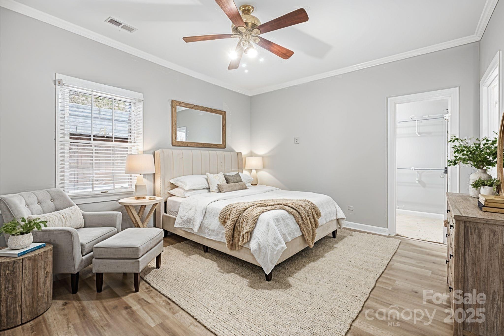 3475 Pikeview Road Fort Mill, SC 29715 - Photo 30 of 48 a bedroom with a large bed mirror and a window