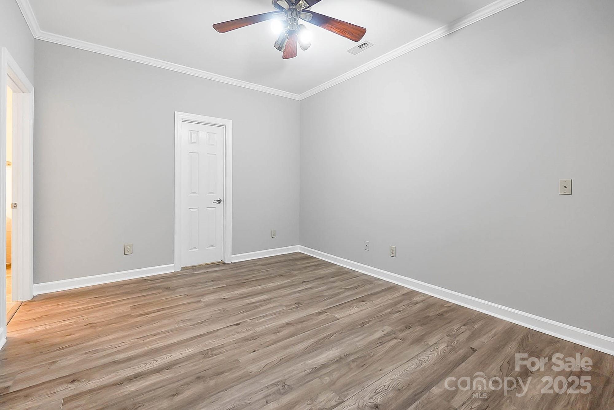 3475 Pikeview Road Fort Mill, SC 29715 - Photo 36 of 48 a view of an empty room with wooden floor